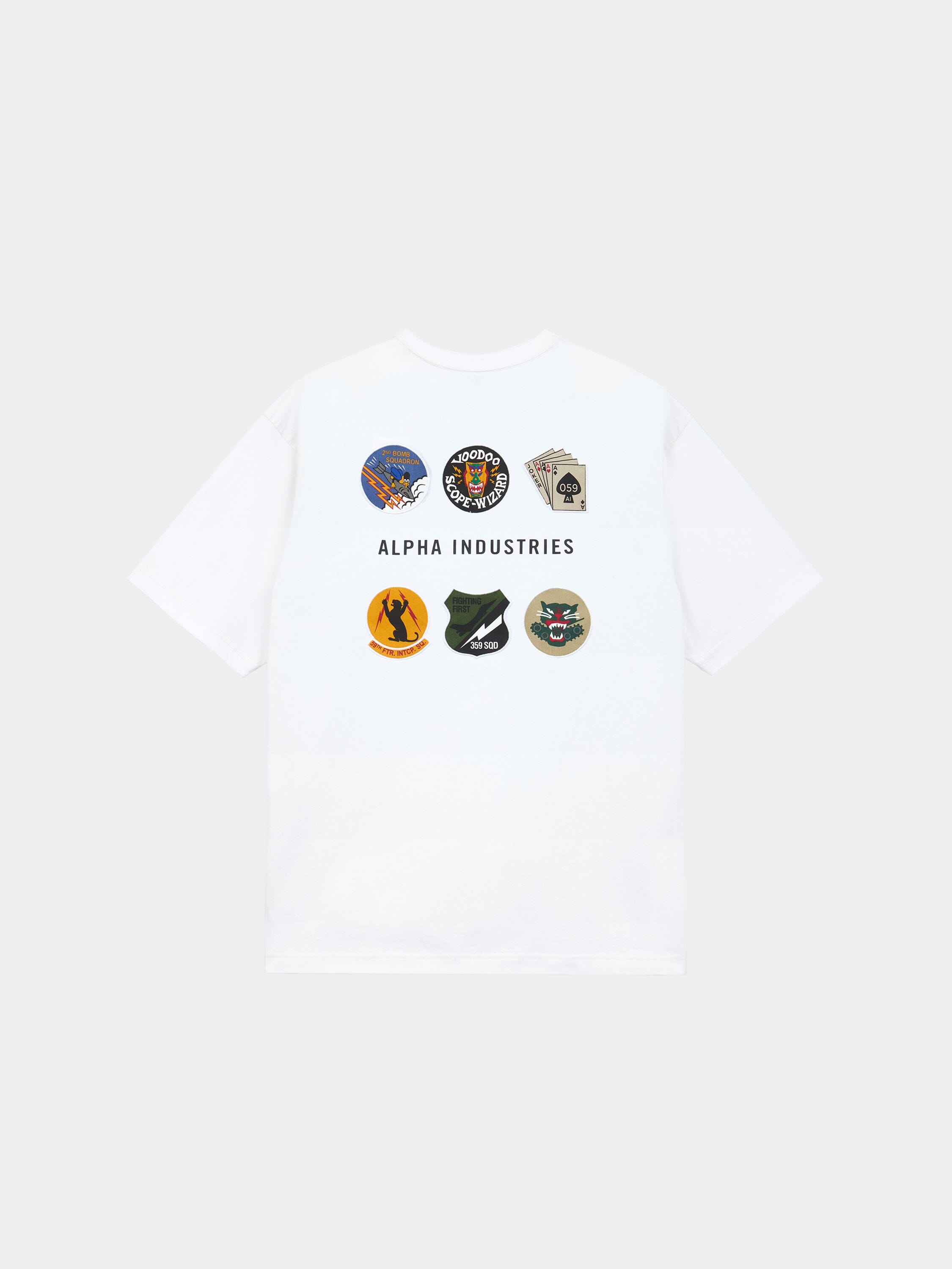 The Alpha Industries Short Sleeve Patched Tee in white with eight military-inspired patches and Alpha Industries text on back.