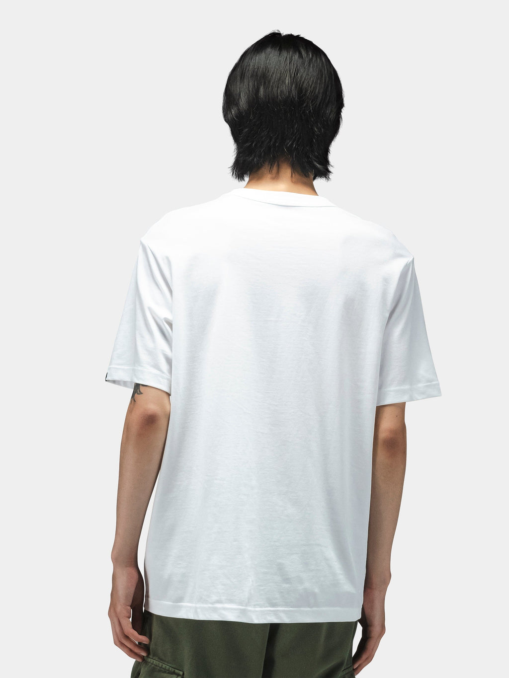 Alpha Industries Short Sleeve Regular Tee in plain white with dark green lightweight cotton pants.