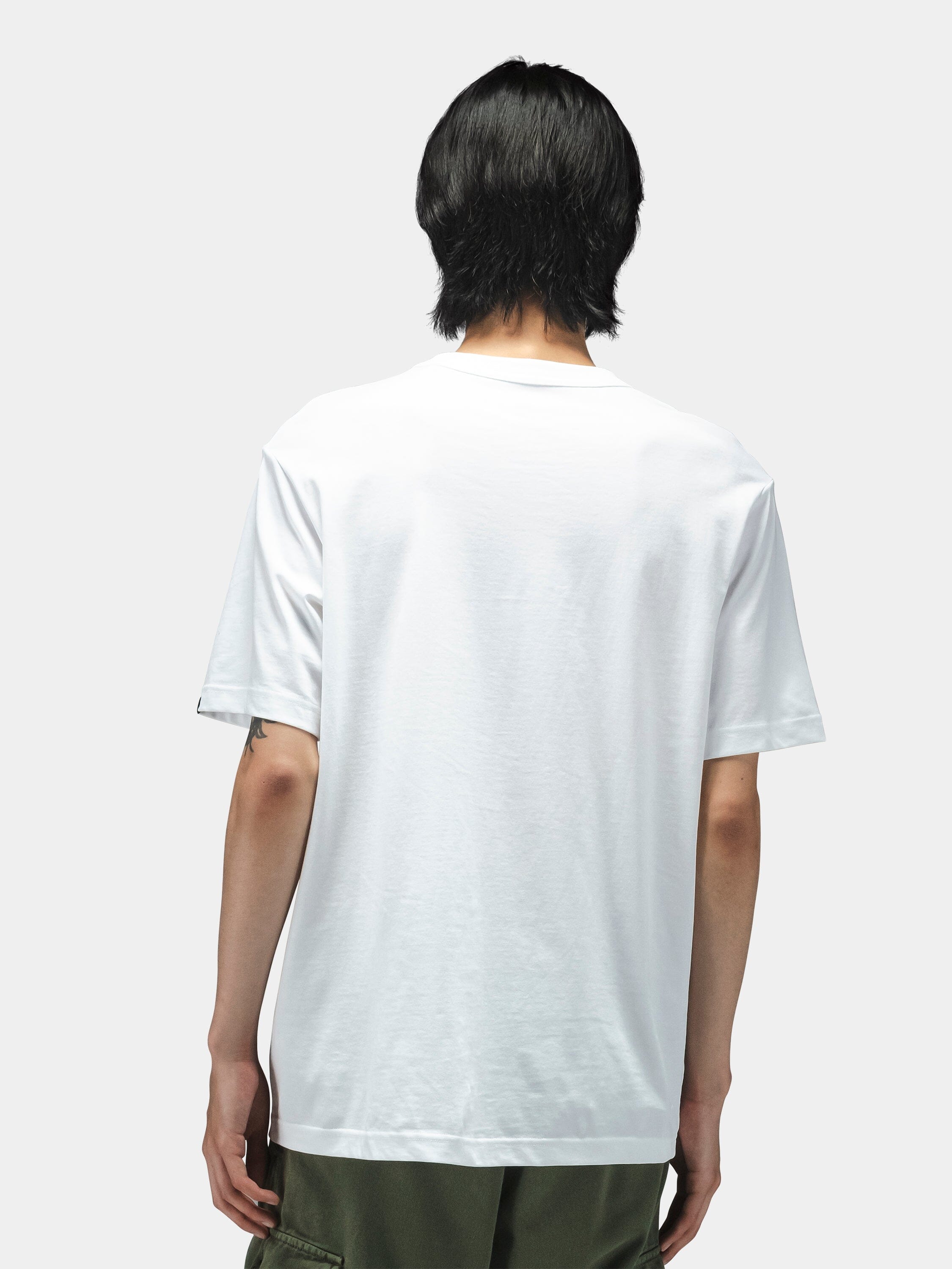 Alpha Industries Short Sleeve Regular Tee in plain white with dark green lightweight cotton pants.