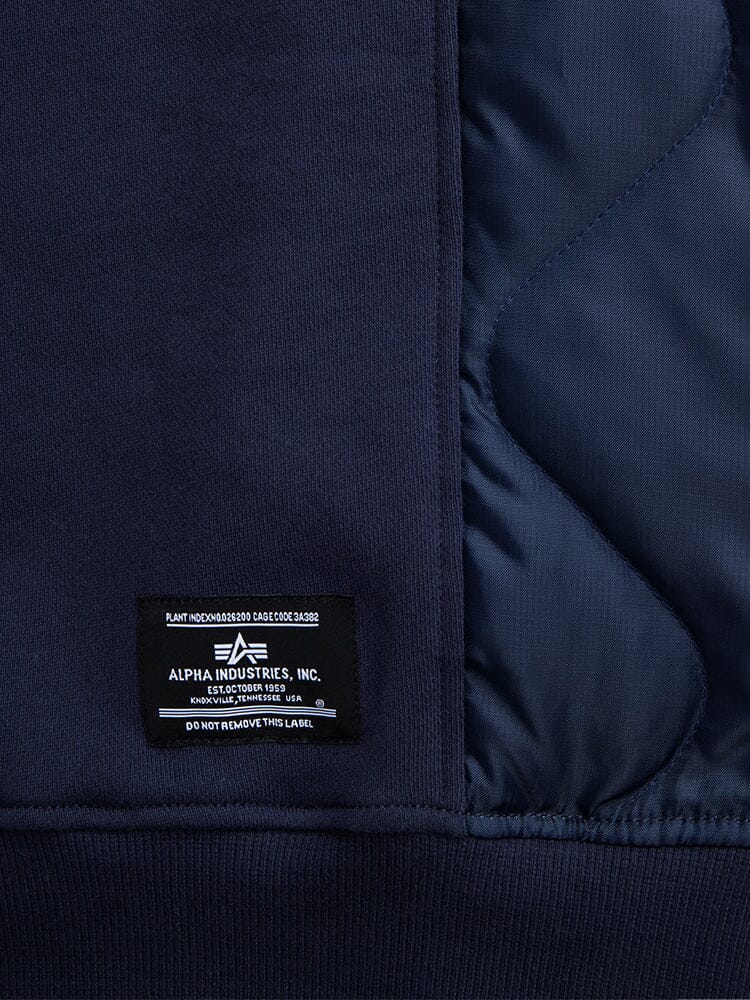 Alpha Industries Short Sleeve Sweatshirt, navy blue, black brand label near hem, onion quilted lining, smooth outer fabric.