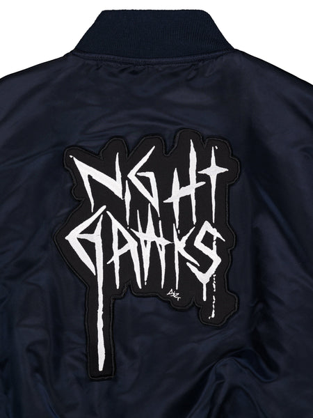 Alpha X 032c Flight Bomber by Alpha Industries in flight nylon with black-and-white MA-1 Night Hawks back patch.