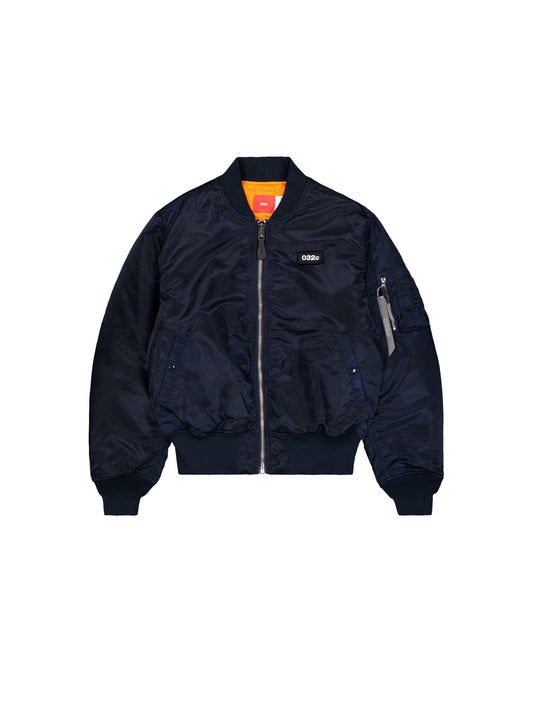 Alpha X 032C Flight Bomber by Alpha Industries, Replica Blue, flight nylon, front zipper, ribbed cuffs and hem, two front pockets, zippered sleeve pocket, orange lining.
