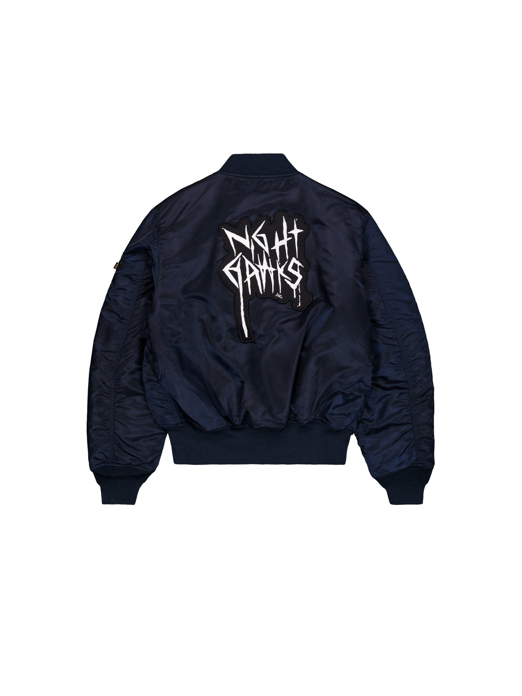 Alpha Industries Alpha X 032C Flight Bomber in navy blue flight nylon with MA-1 design, bold Night Gamis graffiti lettering on back.