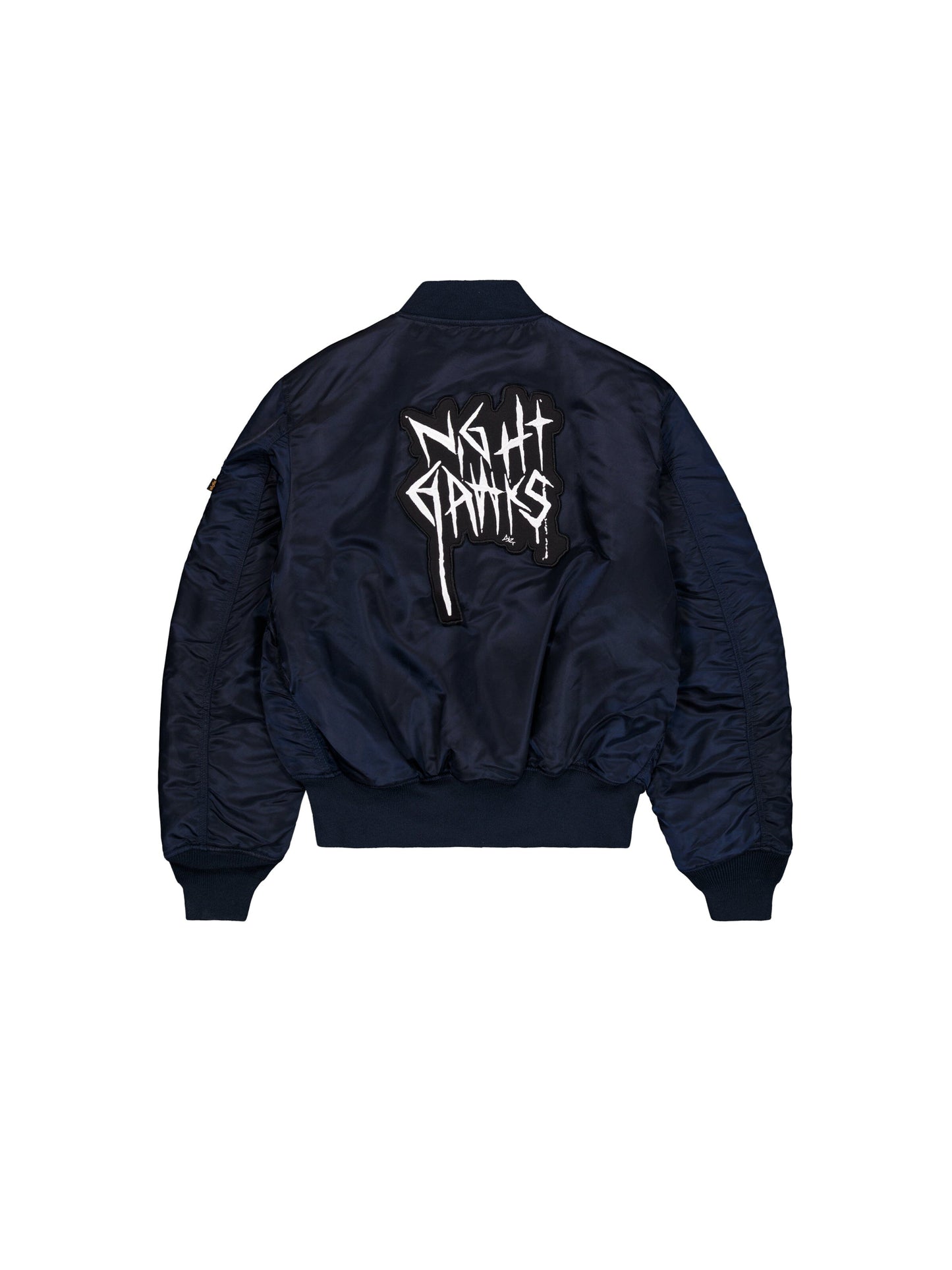 Alpha Industries Alpha X 032C Flight Bomber in navy blue flight nylon with MA-1 design, bold Night Gamis graffiti lettering on back.