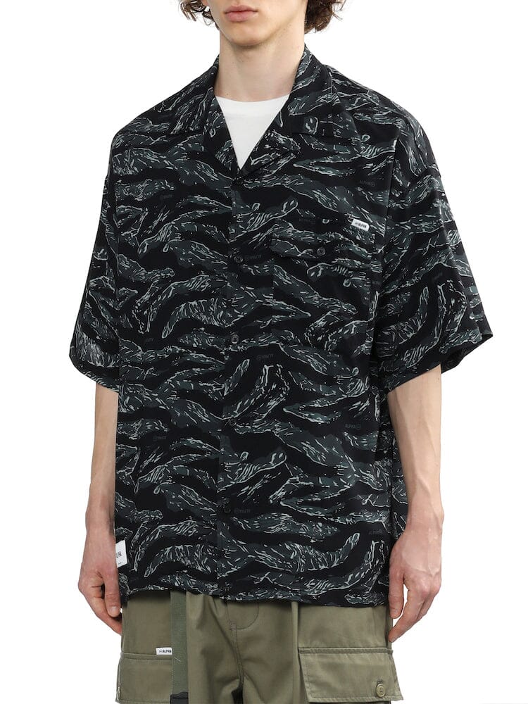UNFRM Army Hawaii Shirt by Alpha Industries, black short-sleeve button-down with white abstract pattern and chest pocket.