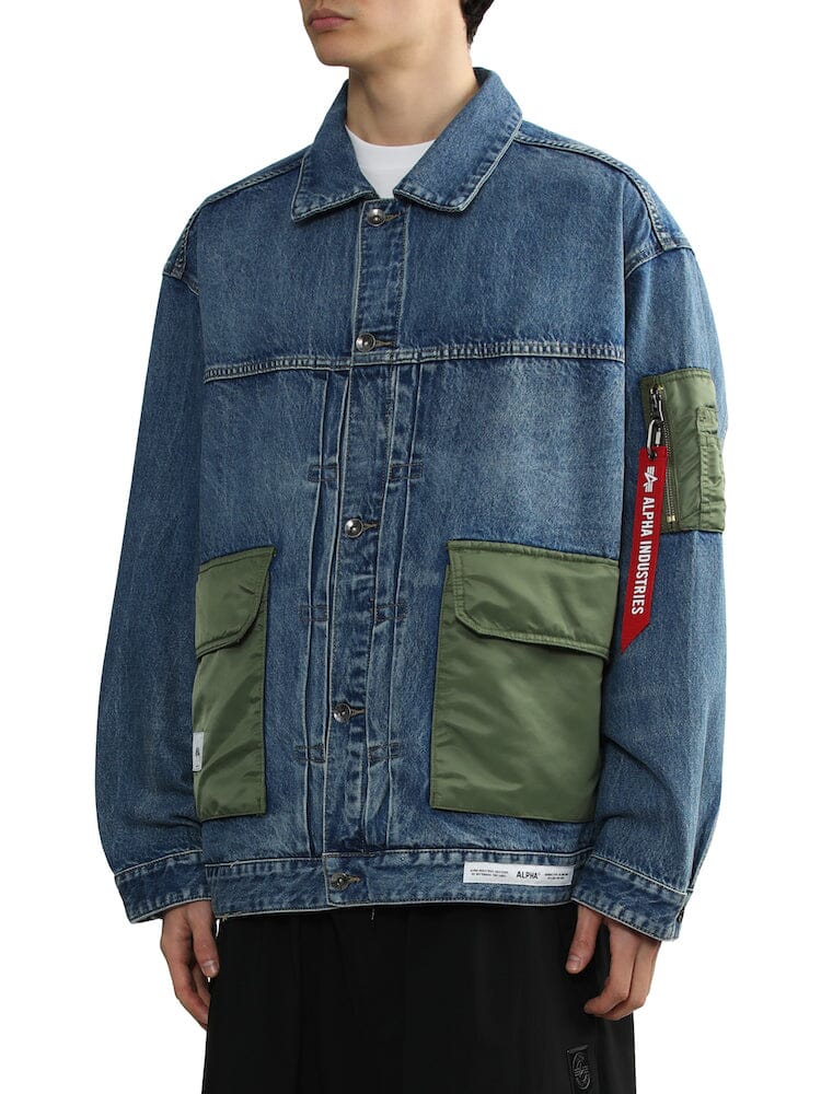 Unfrm Denim Type 2 Army Jacket by Alpha Industries, blue denim with two green utility pockets and red Remove Before Flight sleeve tag.