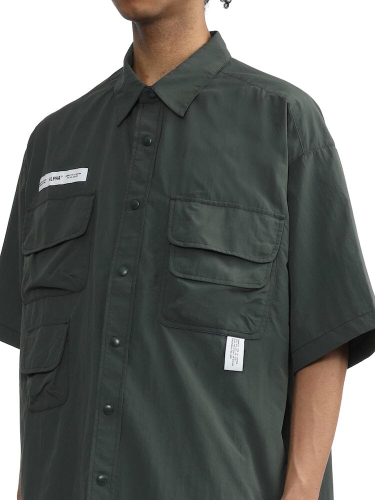 Alpha Industries Nylon Utility Shirt, dark green, short-sleeve, button-up with patch pockets, button front closures, small white labels.