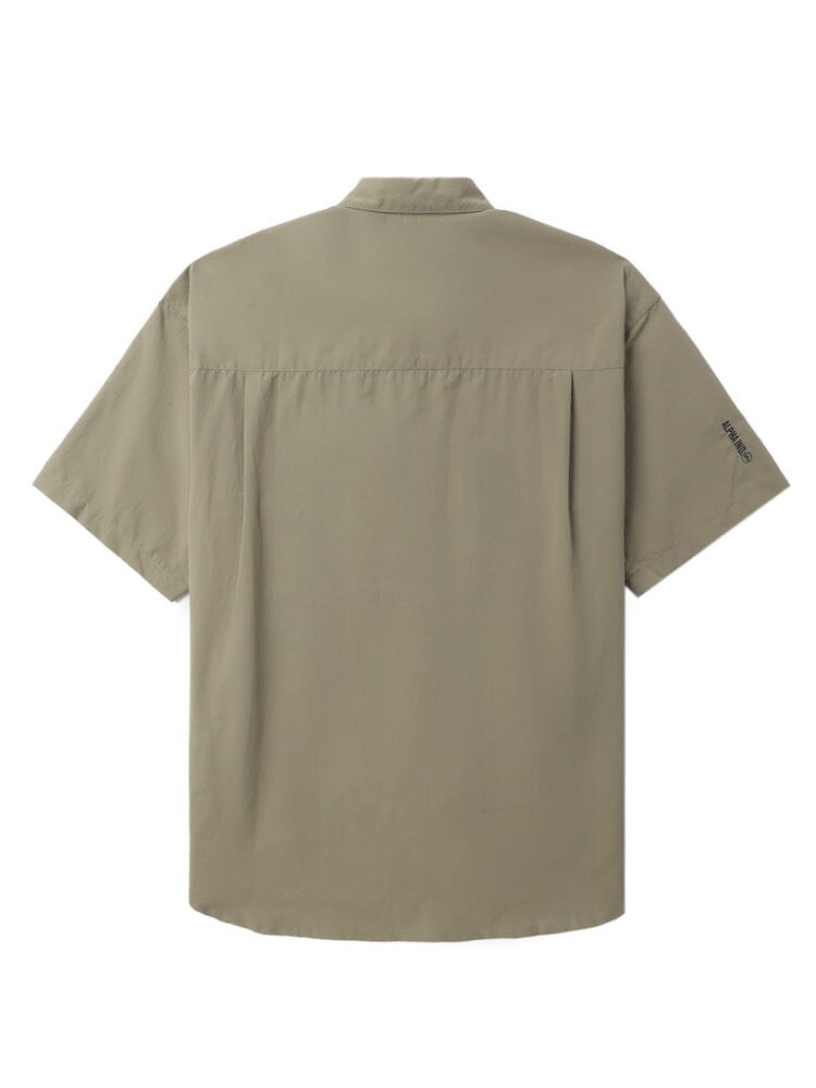 UNFRM Nylon Utility Shirt by Alpha Industries, short-sleeve, light olive-green, button-up with front button closures and small logo on left sleeve.