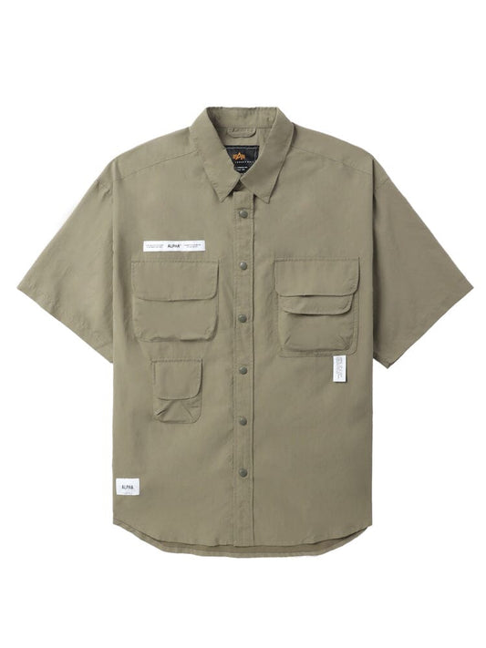 Unfrm Nylon Utility Shirt by Alpha Industries in khaki, short sleeves, patch and multiple front pockets, small white labels on chest and hem.