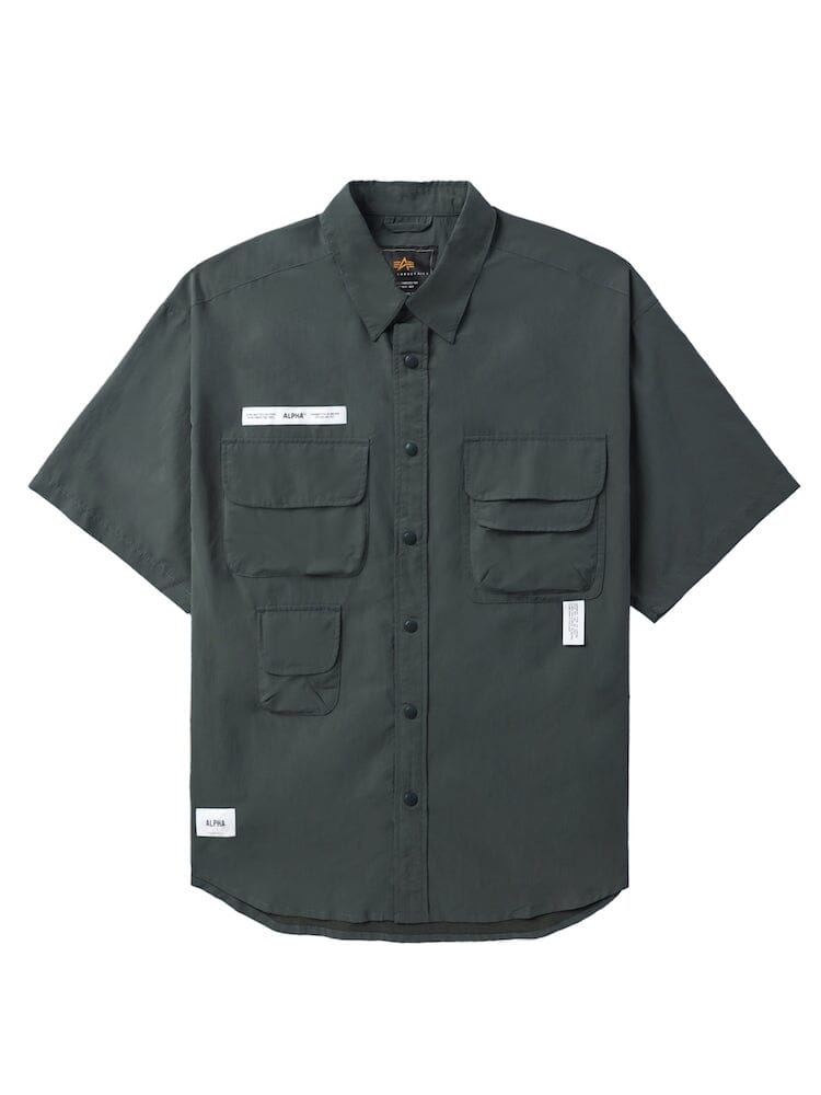 UNFRM Nylon Utility Shirt by Alpha Industries in teal, nylon material, short sleeves, button-up front, chest patch pockets, two lower front pockets, small white label with silicone Alpha print on left chest.