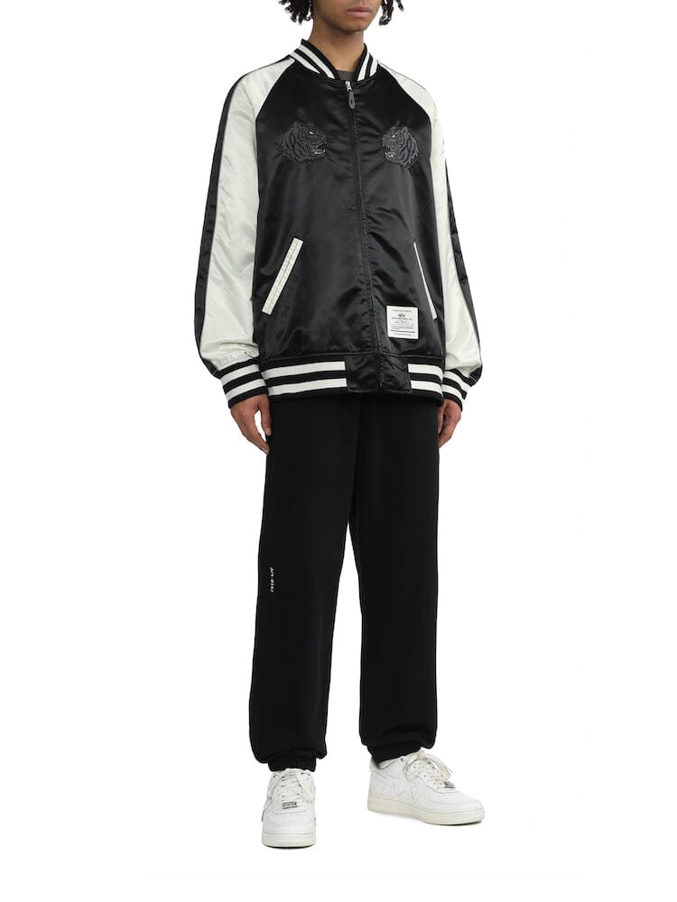 Unfrm Tiger Souvenir Jacket by Alpha Industries, black with embroidered tiger design, ribbed cuffs and hem, front zip closure.