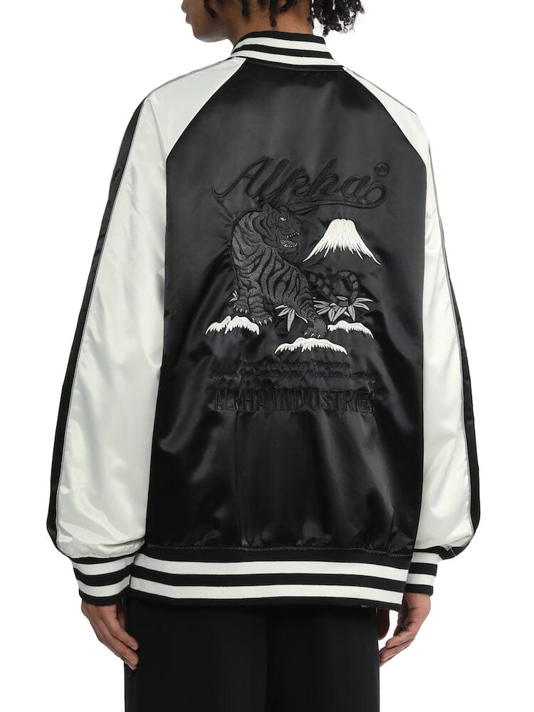 Unfrm Tiger Souvenir Jacket by Alpha Industries, tiger embroidery, mountain and foliage details on back, text accents, striped collar.