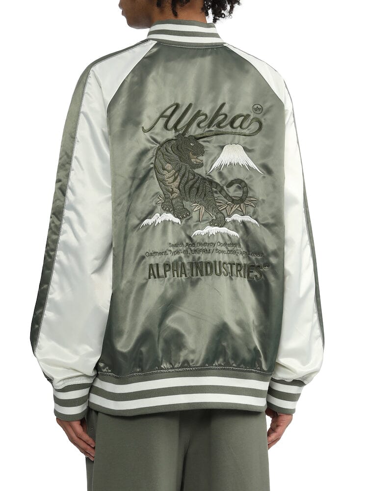 UNFRM Tiger Souvenir Jacket by Alpha Industries, featuring Alpha text, tiger embroidery, and Mount Fuji on the back.