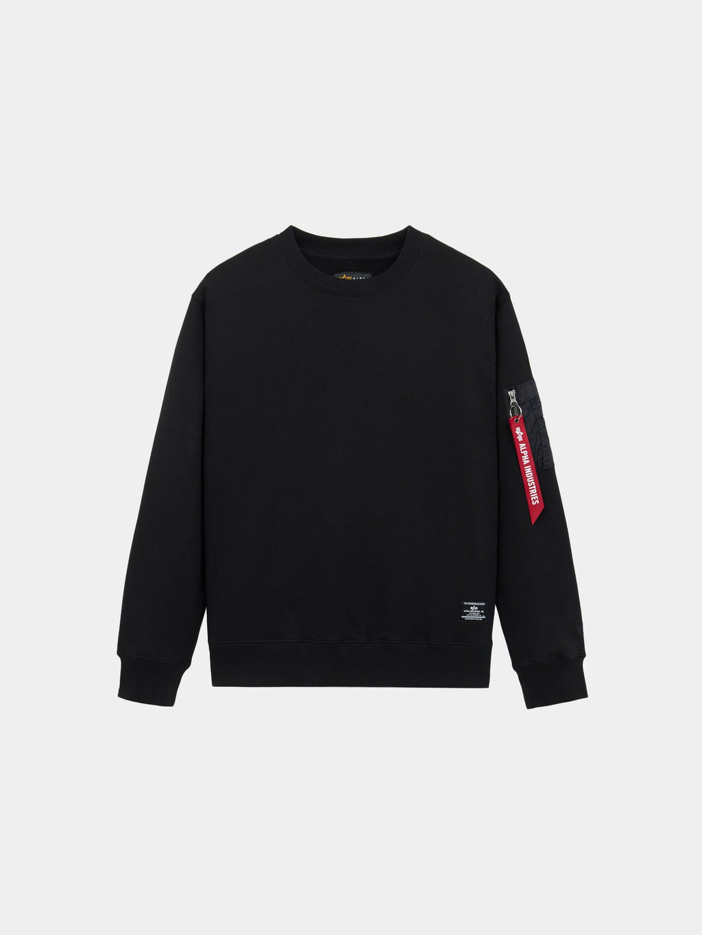 Alpha Industries Utility Pocket Crewneck in black with ribbed cuffs, hem, and MA-1 utility pocket on left sleeve with red tag.