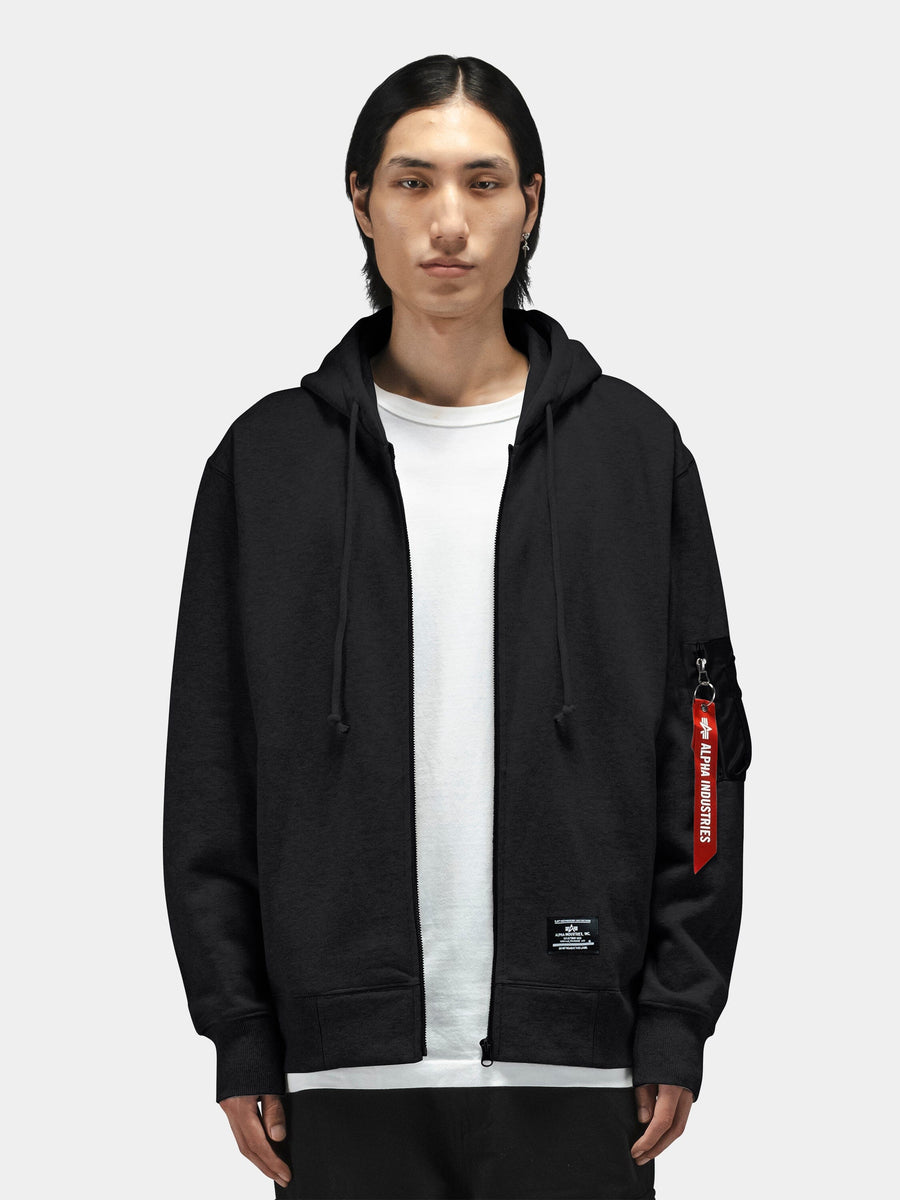 Alpha Industries Utility Pocket Full Zip Up hoodie in black with full zip front and red tag on left sleeve.