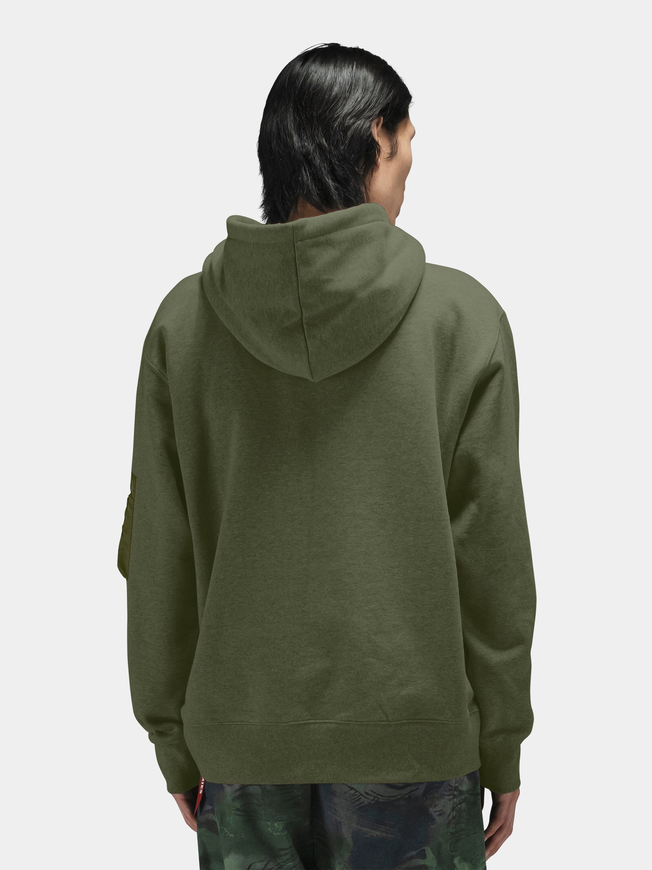 Alpha Industries Utility Pocket Hoodie with MA-1 sleeve pocket and camo pants.