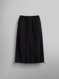 The Women's Drawcord Skirt by Alpha Industries features a black mid-length design with a drawstring hem and bungee waistband.