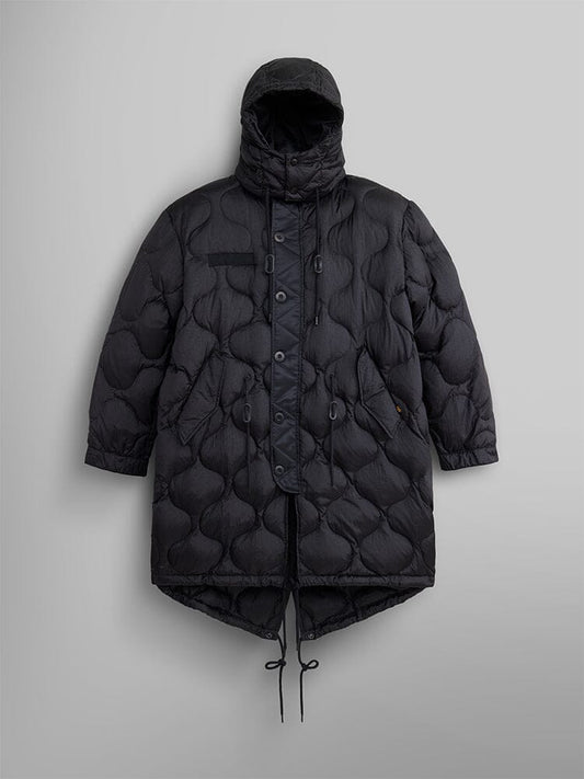 The Women's M-65 Fishtail Puffer in black by Alpha Industries is a water-resistant parka with onion quilting. It features a hood, button closure, and drawstrings.