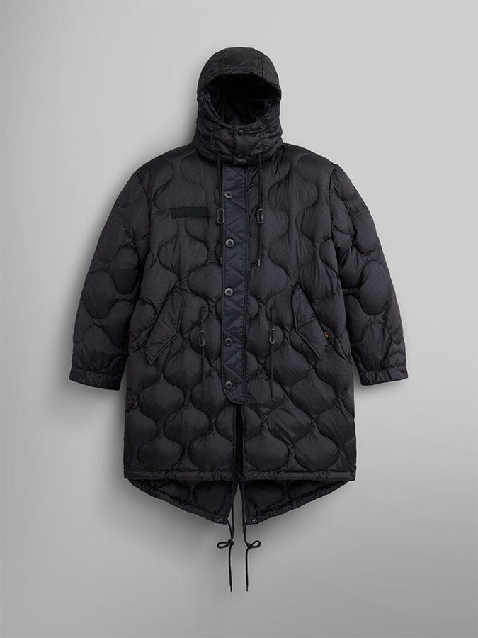 The Women's M-65 Fishtail Puffer in black by Alpha Industries is a water-resistant parka with onion quilting. It features a hood, button closure, and drawstrings.