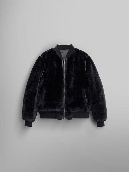 The reversible side of the Women's Reversible Faux Leather MA-1 Bomber Jacket by Alpha Industries, featuring a stylish black faux fur design with a front zipper and ribbed cuffs and hem.