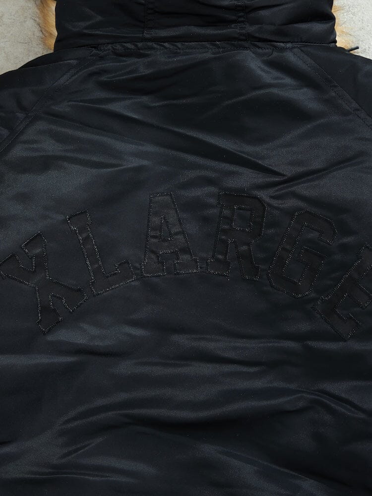 N-2B Core Spec Parka Alpha Industries, black water-repellent nylon, black XLARGE lettering stitched across back.