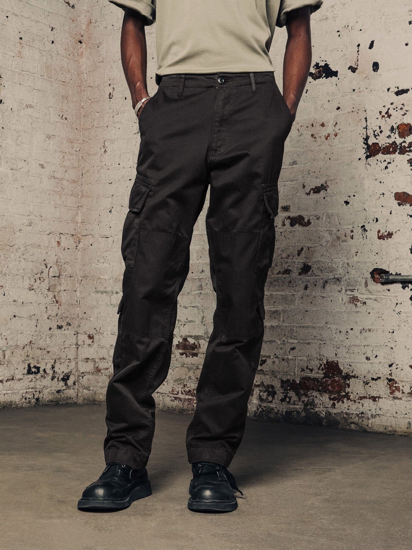 Alpha Industries Acu Pant cargo pants, utility pockets, black color, button and zipper closure.