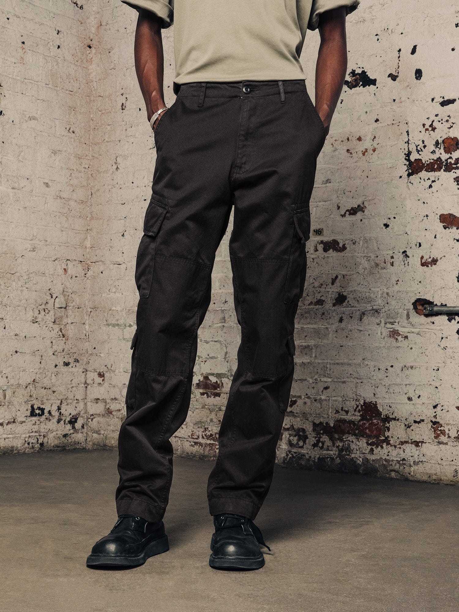 Alpha Industries Acu Pant cargo pants, utility pockets, black color, button and zipper closure.