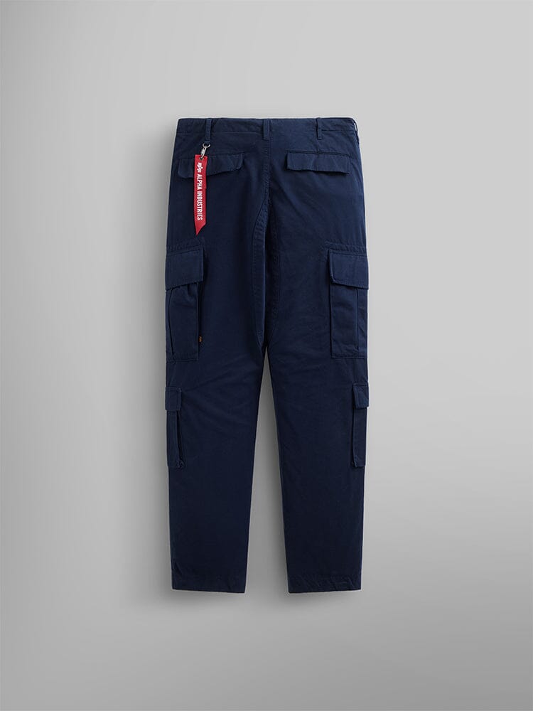 Alpha Industries Acu Pant, navy blue with cargo pockets, nylon knee patches, red fabric tag on rear belt loop.