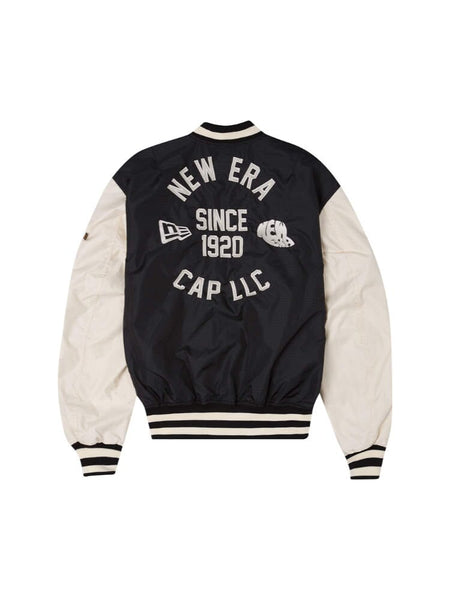 The Alpha X New Era L-2B Bomber Jacket features a striking black and white ripstop design adorned with the iconic New Era Cap LLC text and "Since 1920" on the back, complete with a helmet and logo design.