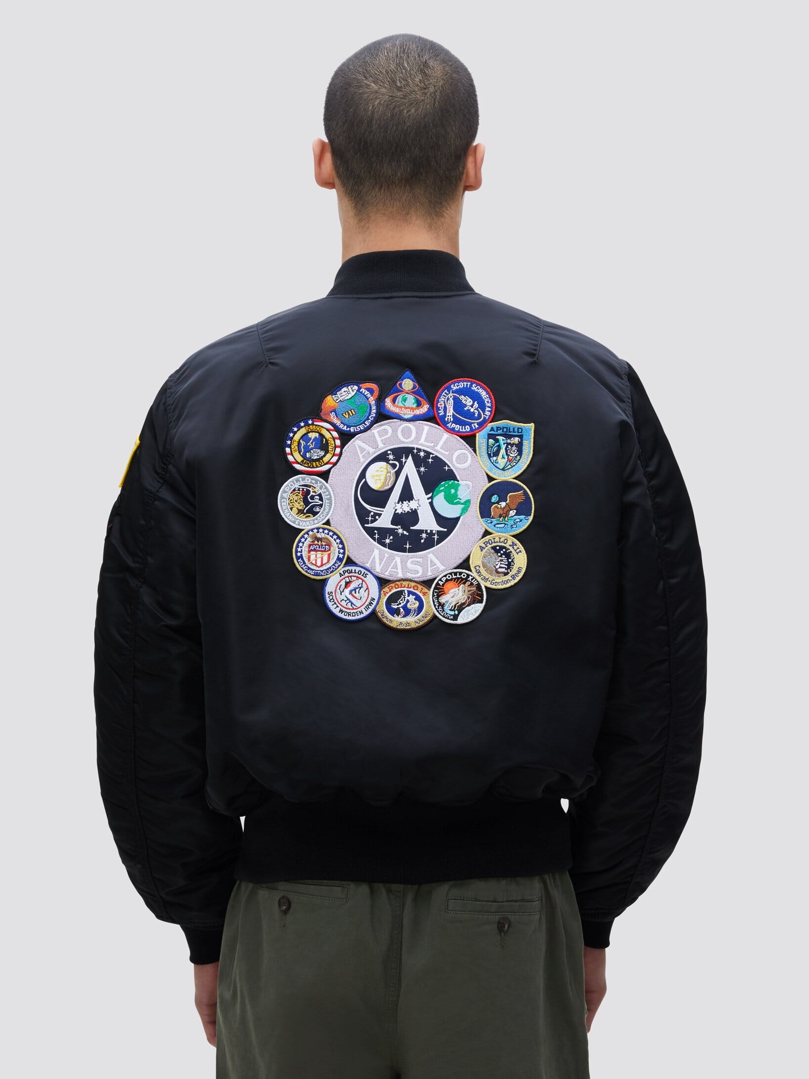 Alpha Industries Ma-1 Bomber Jacket, black, nylon, Apollo mission patches in a circle on back.