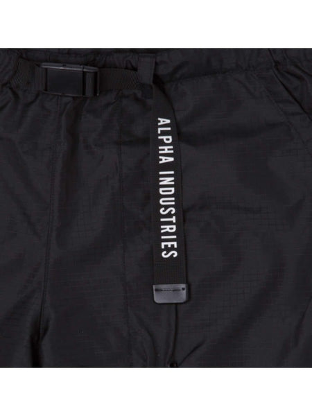 Close-up of the Brooklyn Nets x Alpha x New Era Nylon Shorts in black, showcasing a branded strap with the text Alpha Industries, crafted from durable ripstop fabric.