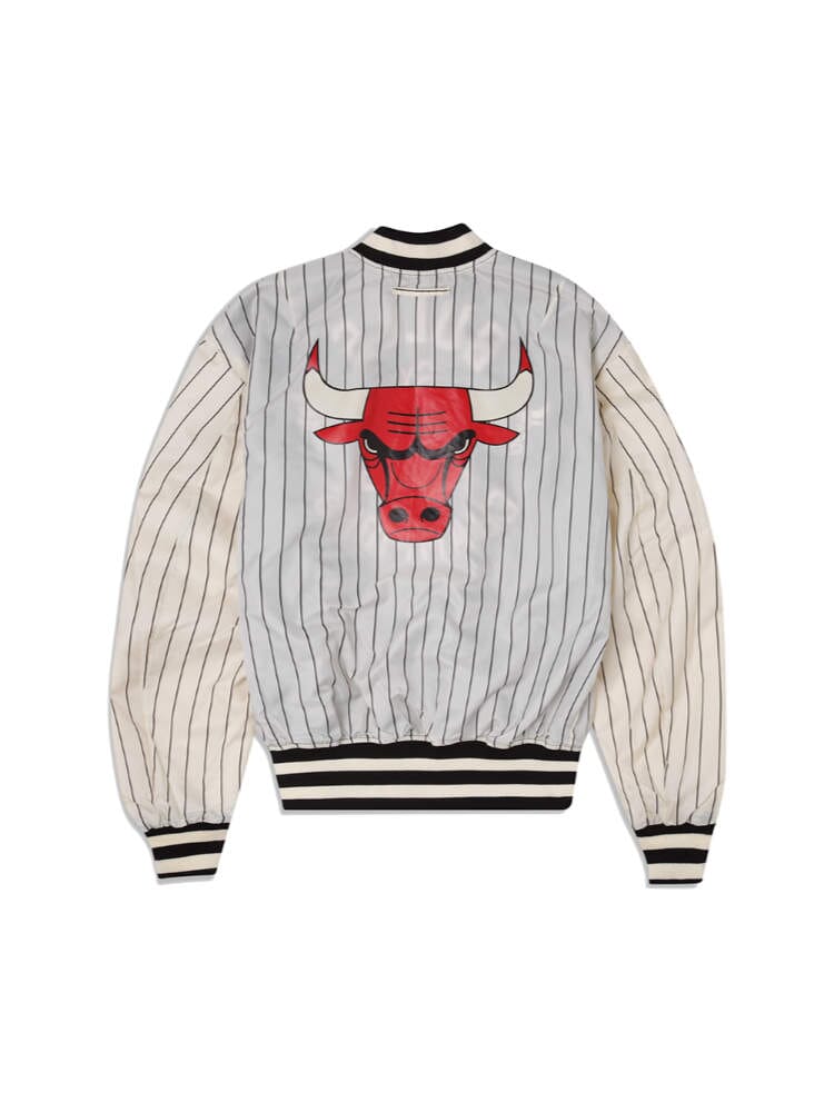 The Chicago Bulls X Alpha X New Era L-2B Bomber Jacket from Alpha Industries features a stylish design with pinstriped sleeves and a bold red bull face logo on the back.