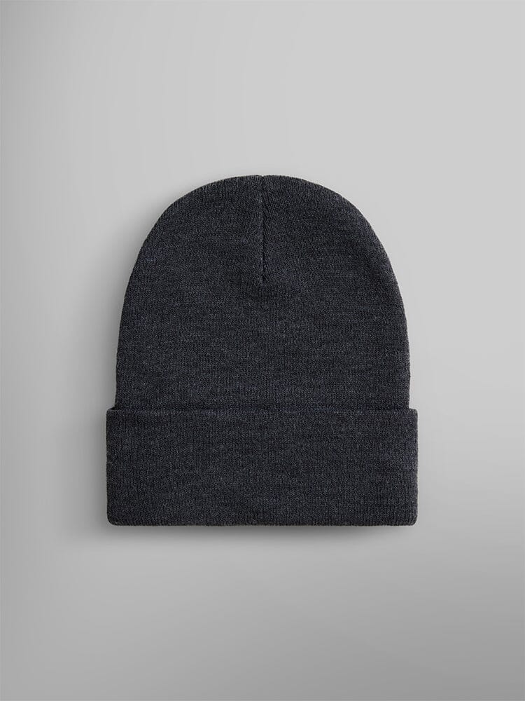 The Essential Beanie by Alpha Industries, Inc. features a plain dark gray knit design with a folded cuff and is enhanced with a subtle paper label for added style.