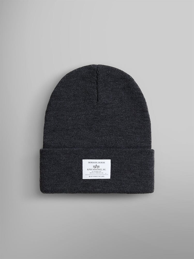 The Essential Beanie, in a Dark Charcoal Heather shade, features a folded brim with an Alpha Industries, Inc. label subtly sewn on the front.