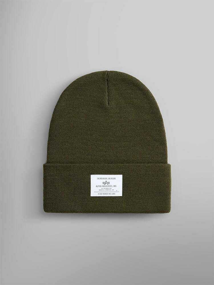 Essential Beanie by Alpha Industries in Olive with folded brim and Alpha paper label featuring text and graphics.