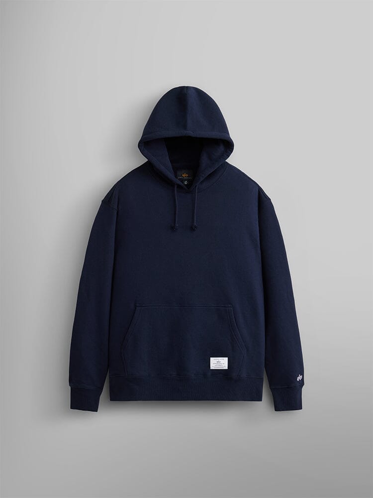 The Essential Hoodie from Alpha Industries in replica blue. This unisex piece features a convenient front kangaroo pocket and an adjustable drawstring hood. 