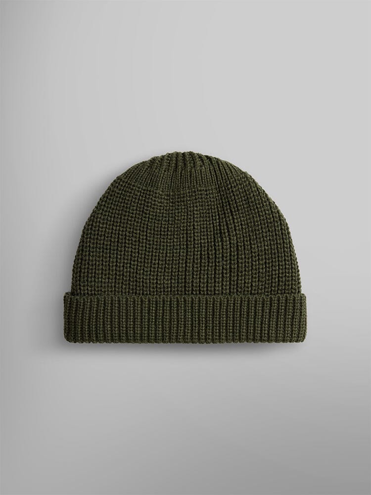 The Essential Watch Cap from Alpha Industries is a dark olive green wool-blend knitted beanie hat, evoking the timeless style of classic watch caps.
