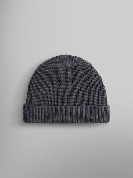 An Essential Watch Cap by Alpha Industries featuring a plain dark gray wool-blend knit design with a folded brim, embodying the classic style of a watch cap.