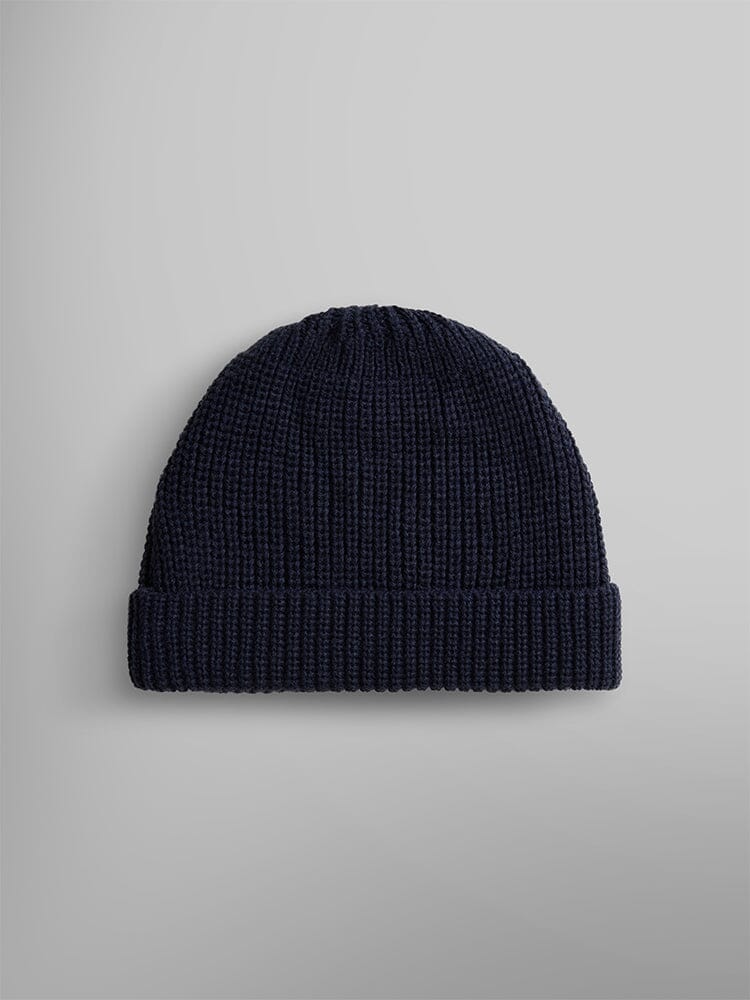 Back view os an essential watch cap in a dark blue wool blend with a folded brim, by Alpha Industries.