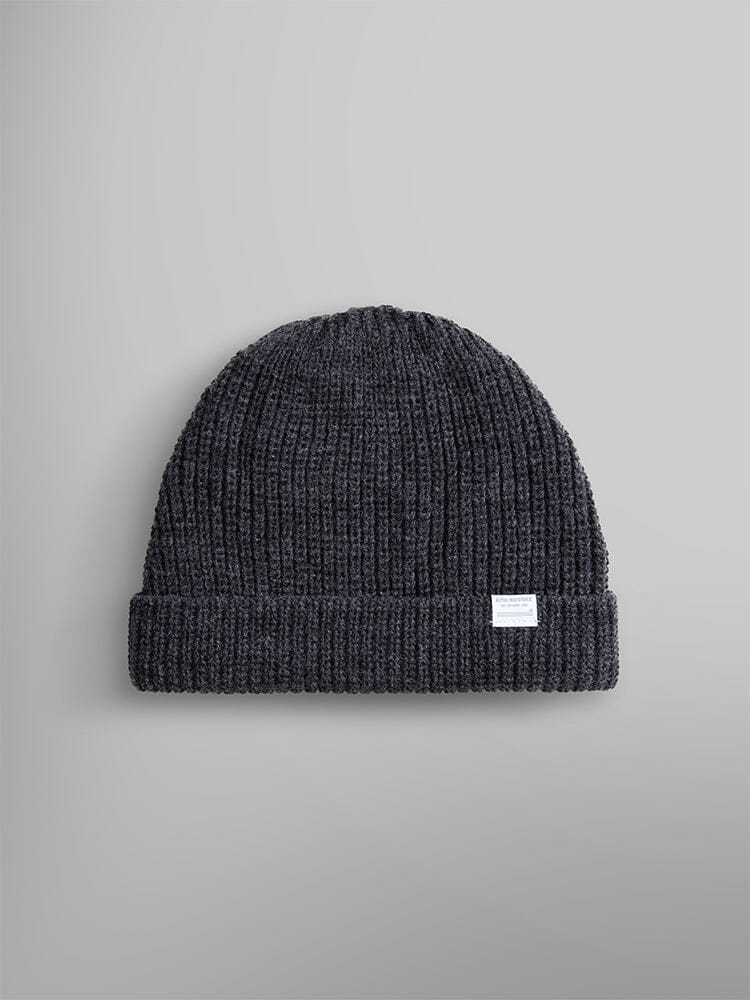 The Essential Watch Cap by Alpha Industries, in a dark charcoal heather wool-blend, features a folded cuff and a small white label, evoking the timeless style of a classic watch cap.