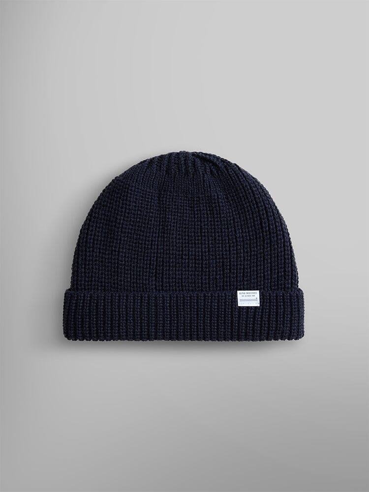 Introducing the Essential Watch Cap from Alpha Industries, in a stunning Replica Blue wool-blend. This classic knitted beanie showcases a small white label on the cuff.