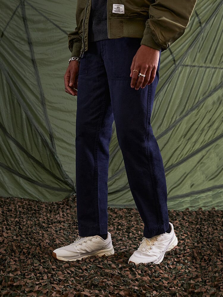 Alpha Industries Fatigue Pant Utility Trousers, Olive Green Jacket, White Sneakers.