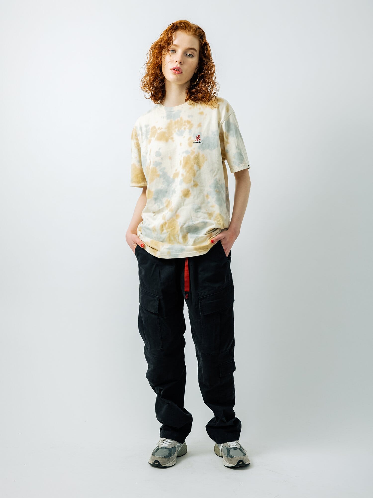 Gramicci X Alpha Cotton Camo Tie Dye Tee by Alpha Industries, black cargo pants with Gramicci logo, gray sneakers.