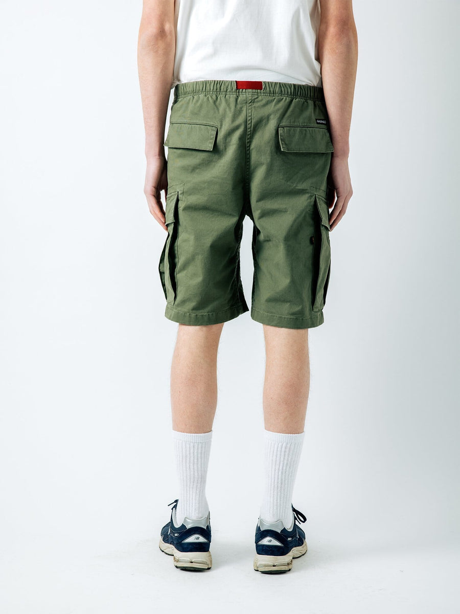 Gramicci X Alpha Jungle Cargo Short by Alpha Industries in olive green with cargo pockets and zip fly closure.