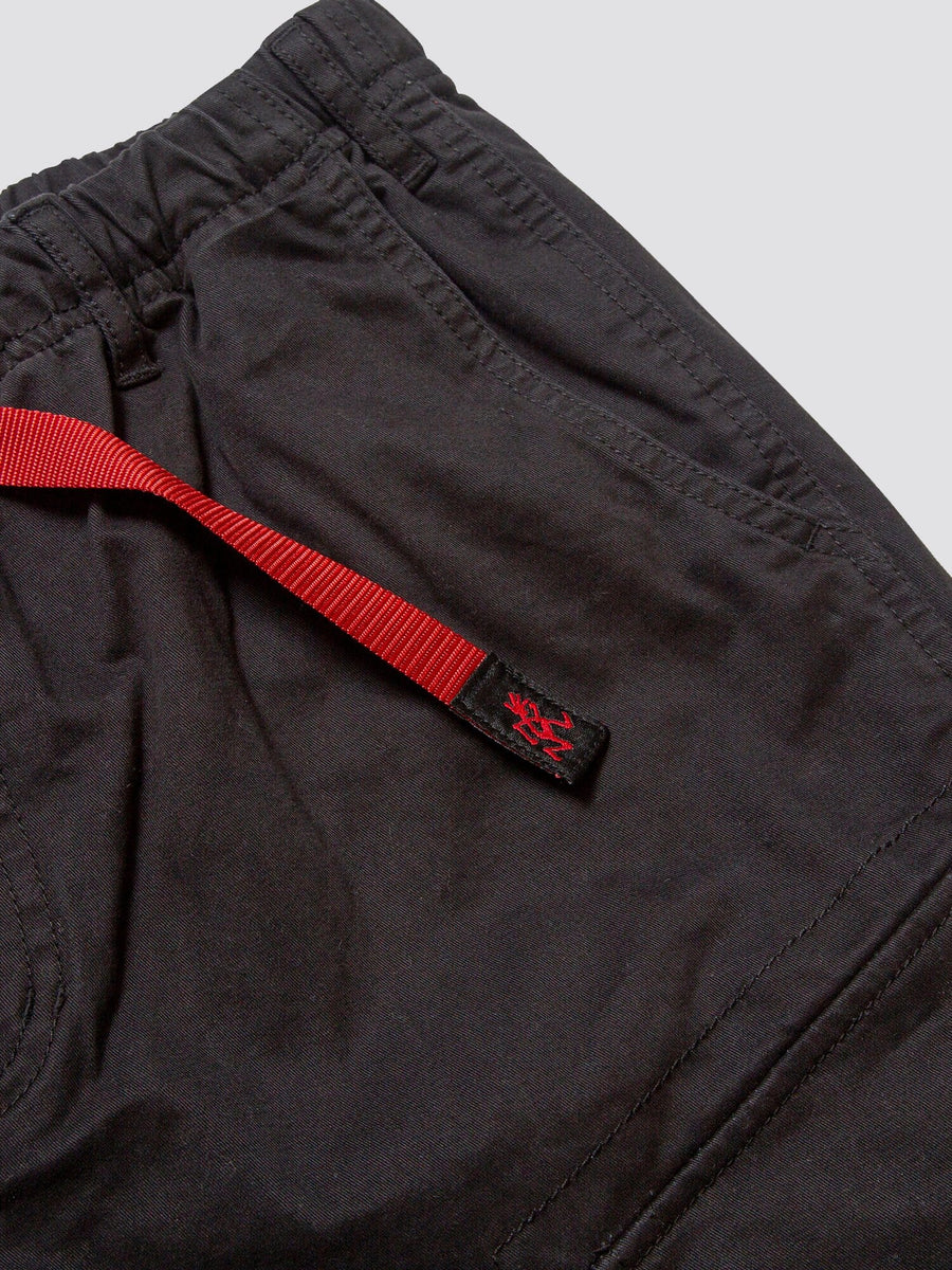 Gramicci X Alpha Jungle Cargo Short by Alpha Industries in black, elastic waistband, side pocket, cargo pockets, red adjustable belt with black patch and small red graphic.