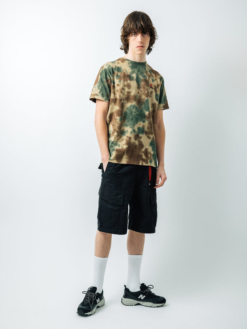 Gramicci X Alpha Jungle Cargo Short by Alpha Industries, tie-dye t-shirt, white socks, black sneakers.