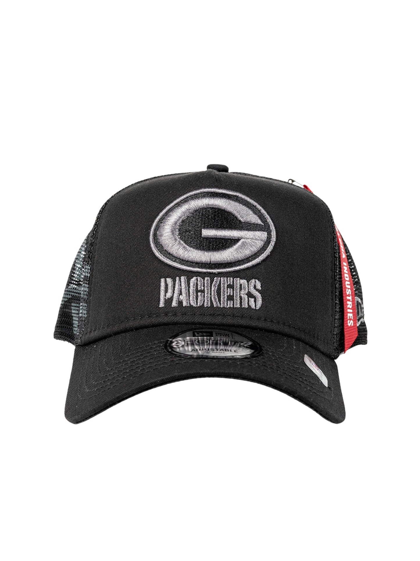 Green Bay Packers x Alpha Industries x New Era 940 Cap, featuring a black cap with a mesh back. The front is adorned with an embroidered stylized G and Packers text in the signature 9FORTY A-Frame Trucker design, complete with tags to proudly display your team spirit.
