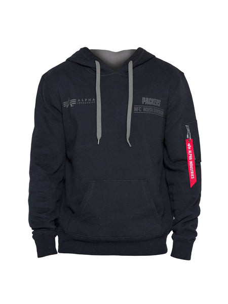 This stylish Green Bay Packers x Alpha X New Era Hoodie merges the iconic aesthetics of Alpha Industries with a sporty flair. It comes in black and features gray drawstrings, logos, and text such as Packers and Alpha Industries. A distinctive red tag on the sleeve reads "Remove Before Flight.