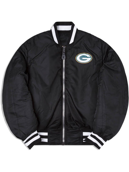Introducing the Green Bay Packers x Alpha Industries x New Era MA-1 Bomber Jacket, a sleek piece featuring a prominent Green Bay Packers logo on the chest. This stylish bomber is designed with classic white and black striped cuffs and collar, making it a standout that seamlessly blends style with team pride.