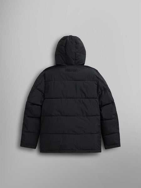 The Hooded Puffer Jacket by Alpha Industries, Inc. showcases its insulated hood, pictured from behind.